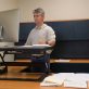 Man using an adjustable desk